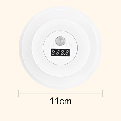 “1+1 ingyen 🎁✨” 🔥50% Kedvezmény🏷️💡 Intelligens LED-es éjszakai lámpa órával – 🌙 mozgásérzékelő, 3 színű fény, 🔋 energiahatékony